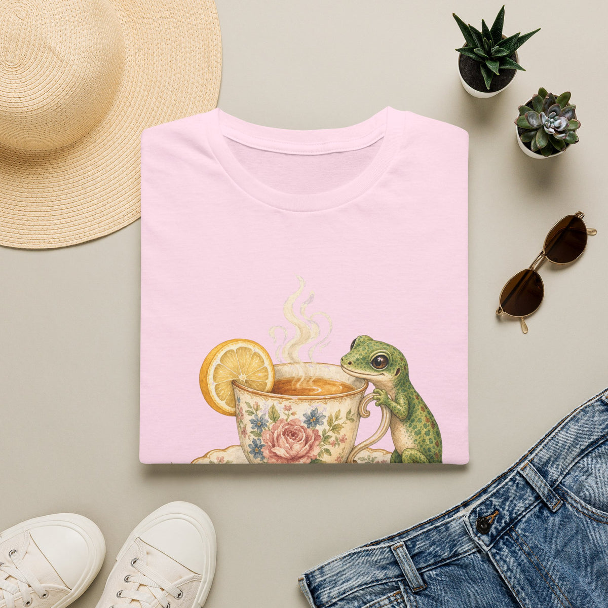 Tea Time Gecko cottagecore watercolor T-shirt from Gold Gecko Co. — gecko sipping from a floral teacup among daisies and lavender.