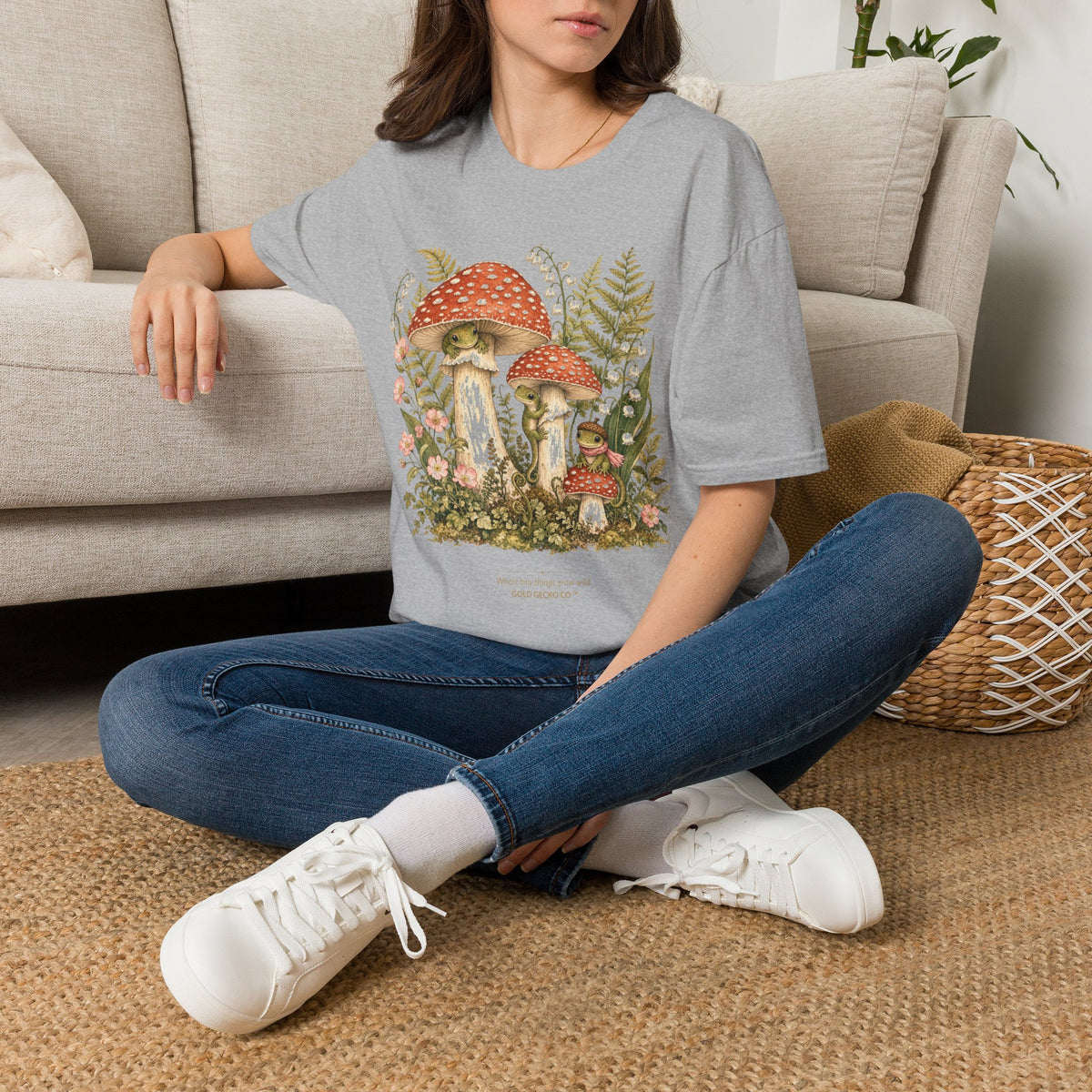 Mushroom Village cottagecore watercolor T-shirt from Gold Gecko Co. — gecko exploring a whimsical toadstool village in the woods.