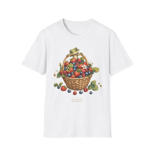 Berry Basket Buddy cottagecore watercolor T-shirt from Gold Gecko Co. — gecko nestled in a woven basket of wild strawberries and blueberries.