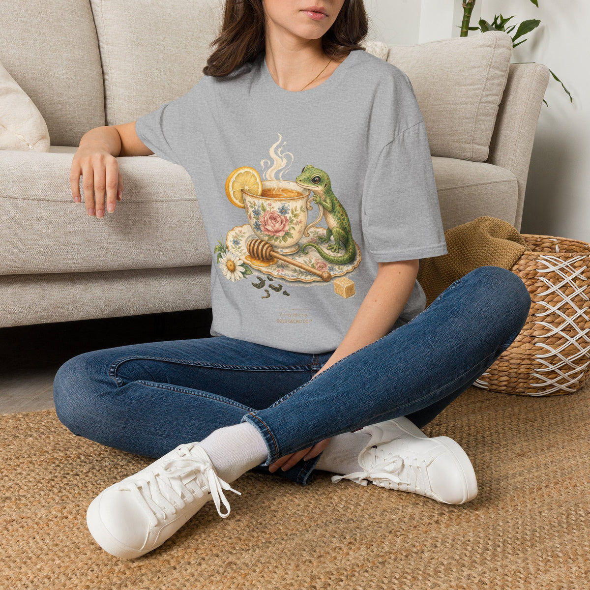 Tea Time Gecko cottagecore watercolor T-shirt from Gold Gecko Co. — gecko sipping from a floral teacup among daisies and lavender.