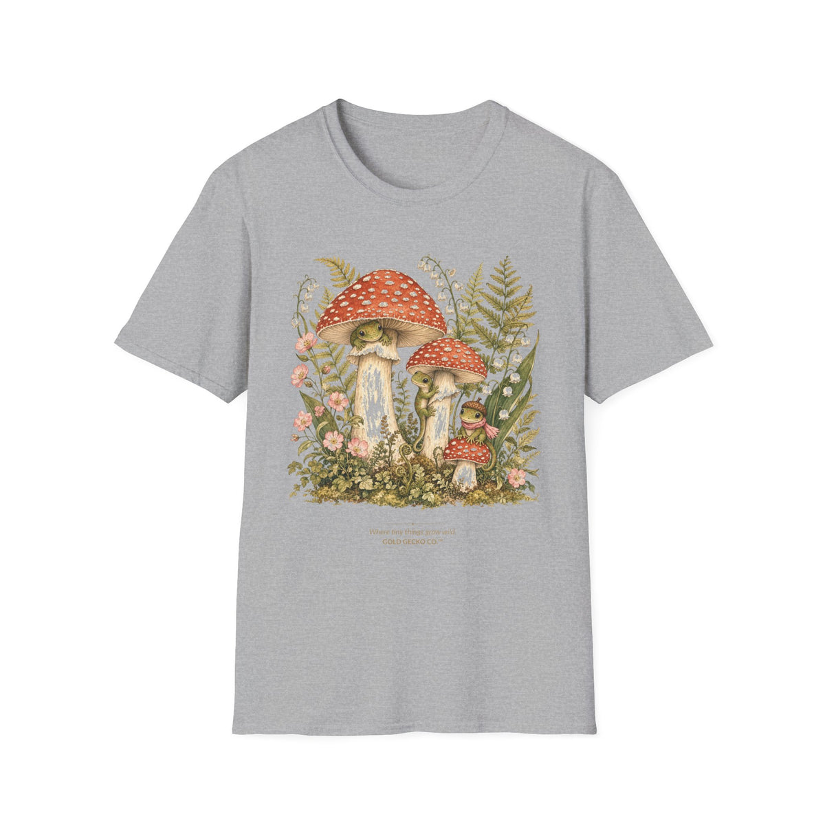 Mushroom Village cottagecore watercolor T-shirt from Gold Gecko Co. — gecko exploring a whimsical toadstool village in the woods.