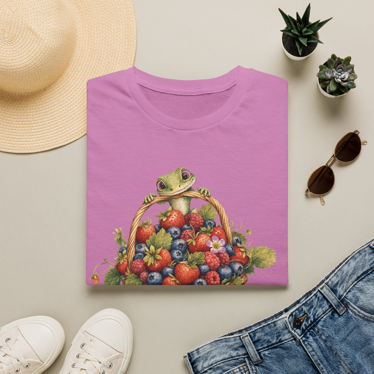 Berry Basket Buddy cottagecore watercolor T-shirt from Gold Gecko Co. — gecko nestled in a woven basket of wild strawberries and blueberries.