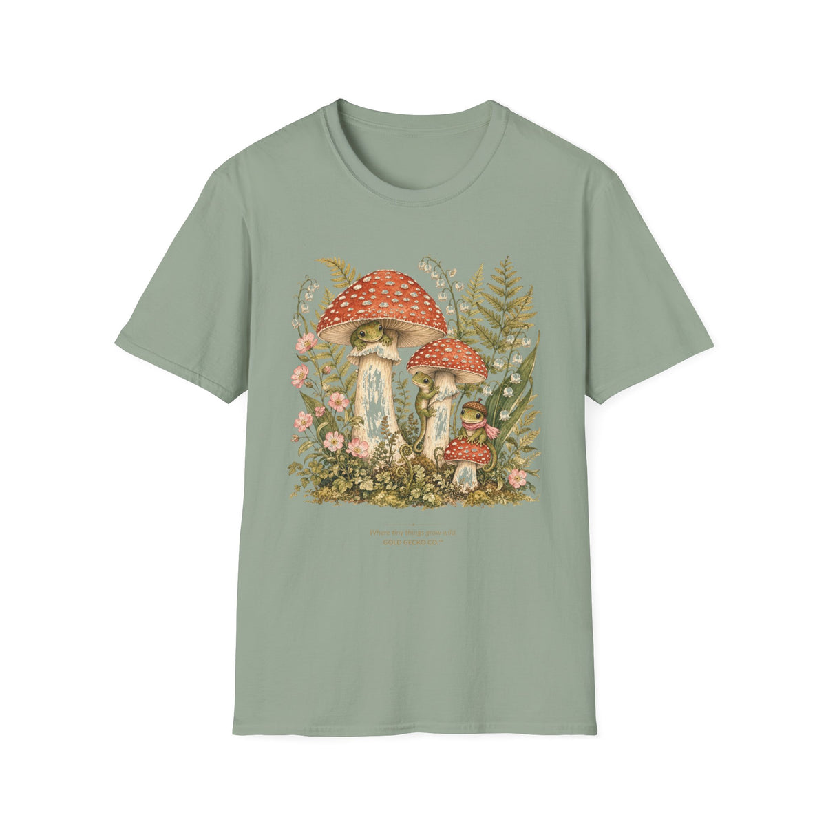 Mushroom Village cottagecore watercolor T-shirt from Gold Gecko Co. — gecko exploring a whimsical toadstool village in the woods.