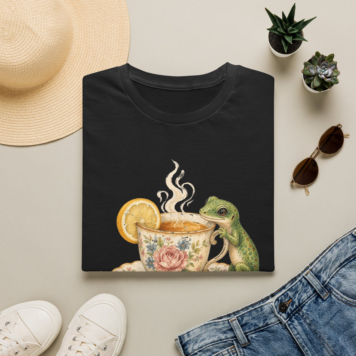Tea Time Gecko cottagecore watercolor T-shirt from Gold Gecko Co. — gecko sipping from a floral teacup among daisies and lavender.