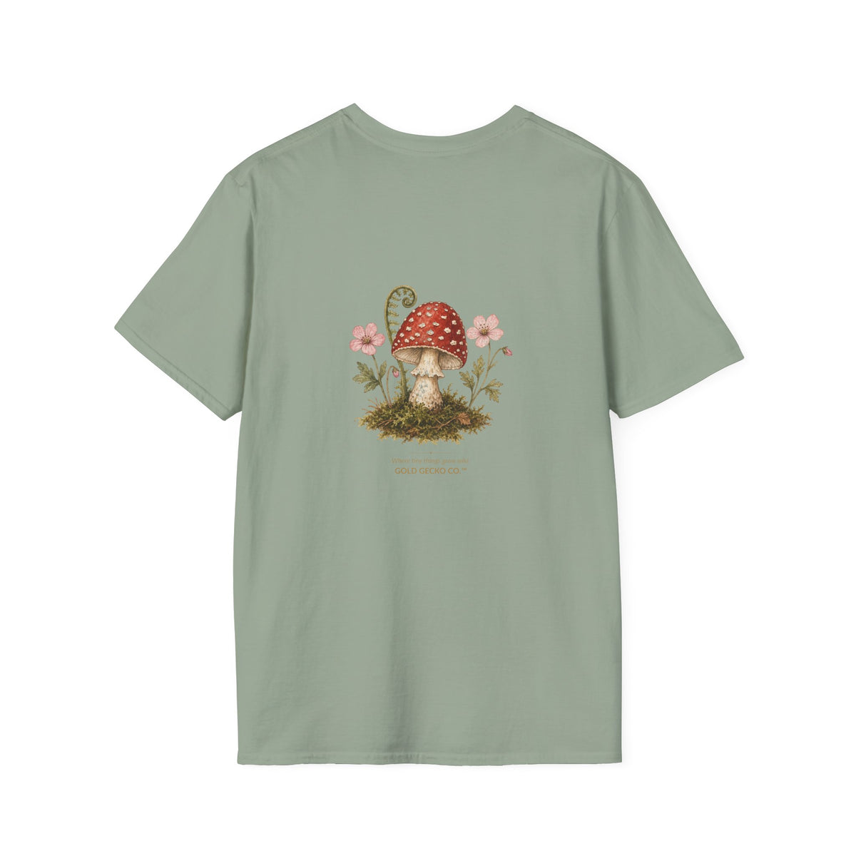 Mushroom Village cottagecore watercolor T-shirt from Gold Gecko Co. — gecko exploring a whimsical toadstool village in the woods.