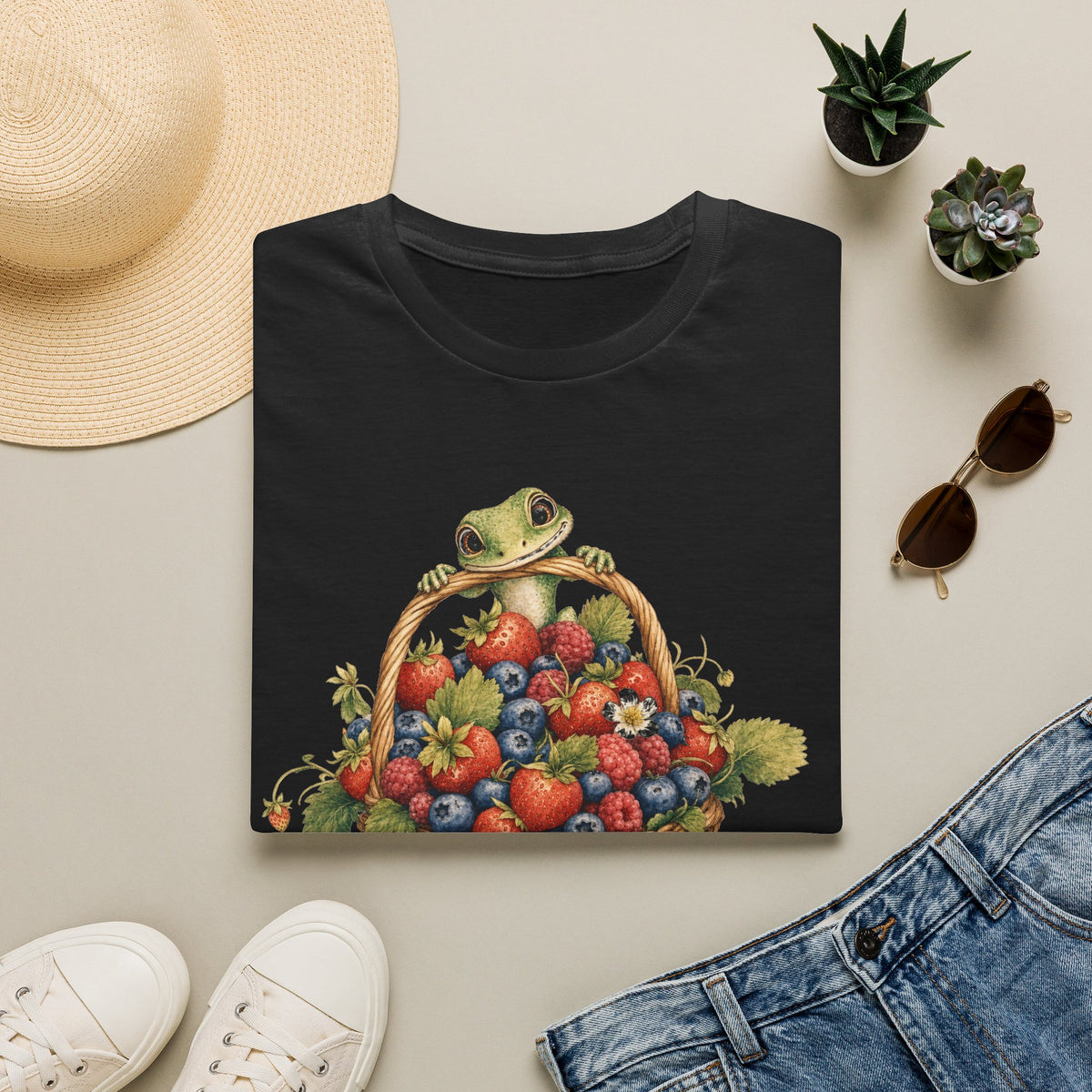 Berry Basket Buddy cottagecore watercolor T-shirt from Gold Gecko Co. — gecko nestled in a woven basket of wild strawberries and blueberries.