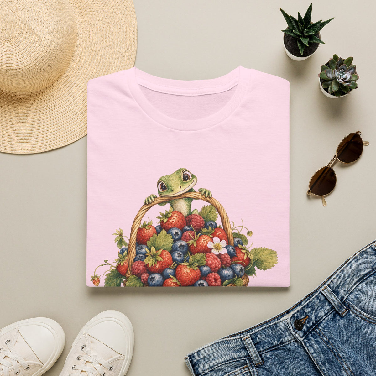 Berry Basket Buddy cottagecore watercolor T-shirt from Gold Gecko Co. — gecko nestled in a woven basket of wild strawberries and blueberries.