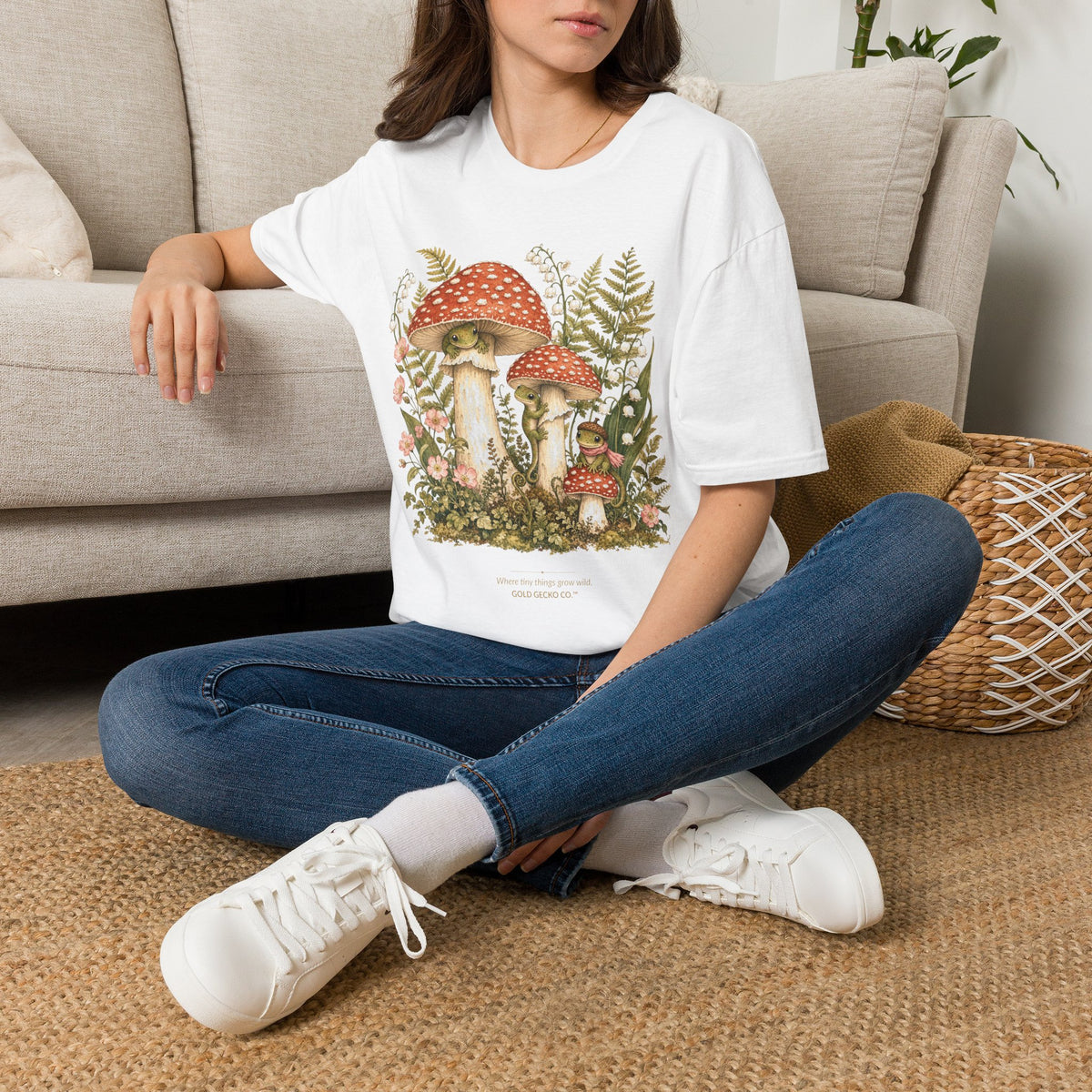 Mushroom Village cottagecore watercolor T-shirt from Gold Gecko Co. — gecko exploring a whimsical toadstool village in the woods.
